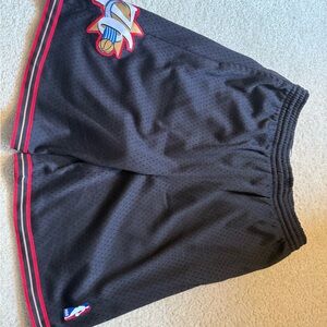 Black Mitchell and Ness men's NBA Basketball Shorts with Red Trim. Size XL.